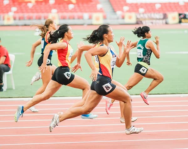 women sprinting | avoid stagnation